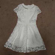 Nwot White Sheer Dress With Flower Embroidery. Very Well Made, No Tags From Sample Line. Fully Lined, Short Sleeve, Full Skirt, Above Knee, Back Zipper Closure. Fits Like Small/Medium. No Stretch. See Measurements. Length 34" Shoulder To Shoulder 14" Armpit To Armpit 17" Waist 13.5" White Embroidered Lace Dress With Short Sleeves, Embroidered Short Sleeve Lace Dress For Summer, White Fitted Short Sleeve Embroidered Dress, Summer Lace Dress With Floral Embroidery And Short Sleeves, Embroidered Lace Dress With Short Sleeves For Summer, White Embroidered Short Sleeve Party Dress, White Short Sleeve Embroidered Party Dress, White A-line Mini Dress With Floral Embroidery, White Embroidered Short Sleeve Dress For Party