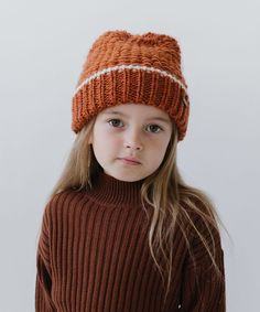 The best accessory for kid’s winter activities is the Vail. This beanie is defined by a chunky knit to keep your little one toasty warm all season long. Inside is a plush band ensuring extra comfort. Contrasting knit patterns gives the Vail an elevated, textured look to go with anything. Orange Winter Hat With Short Brim, Orange Beanie For Winter, Toddler Winter Hat, Orange Beanie Hat, Toddler Beanie, Halo Style, Find Color, Wearing A Hat, Orange Cream