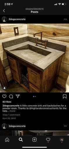 a bathroom sink sitting under a mirror next to a wooden counter top in a room