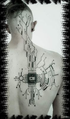 a man's back with an electronic circuit board tattoo on his upper body and neck