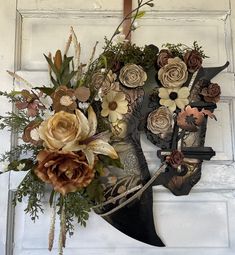 a metal mask with flowers on the front door