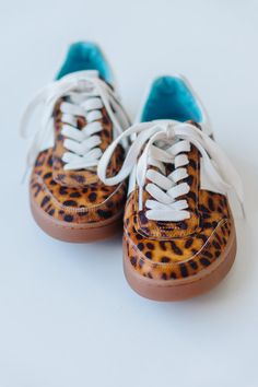 Step into sass with Matisse's Quincy sneaker in a fierce tan leopard print. These kicks will elevate any outfit and add a playful touch to your shoe collection. Walk on the wild side comfortably with the perfect combination of style and comfort. Trendy Brown Sneakers With Speckled Midsole, Sporty Sneakers With Leopard Print And Round Toe, Leopard Print Sneakers With Round Toe And Rubber Sole, Leopard Tennis Shoes, Sporty Leopard Print Sneakers With Round Toe, Leopard Print Leather Sneakers With Branded Insole, Trendy Leopard Print Leather Sneakers, Leopard Print Sneakers With Rubber Sole, Leopard Print Leather Sporty Sneakers