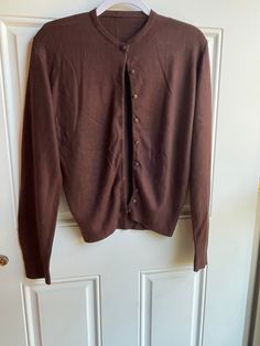 This authentic 1970's vintage brown cardigan sweater is in good condition with a little pilling. It is long sleeved with buttons up the front. Bust-36 inches Length-23 inches Sleeve-25 inches To see more of our vintage 1970's clothing inventory please visit our store at ChoiceRecycling.  We add new items every week. Thank you, Karmyn Brown Buttoned Sweater For Winter, Retro Brown Sweater For Fall, Vintage Long Sleeve Cardigan For Fall, Classic Brown Sweater With Button Closure, Classic Fitted Brown Cardigan, Fitted Classic Brown Cardigan, Fitted Brown Cardigan For Fall, Classic Brown Cardigan With Button Closure, Classic Brown Sweater With Buttons