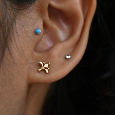 "Inspired from the beautiful Mughal motifs, this gold floral stud is a perfect piece for all your piercings. Crafted in 14k solid gold, this one of a kind pin makes for a great gift for a piercing lover and your loved ones. Great for your tragus, lobe, conch, helix, flat piercing. It also makes for a mesmerizing nose jewelry. * Dimension : 7x7mm (approx.) * Material : 14k Solid Gold If you like this stud, please press \"Pin it\" button on the top of your screen. Follow us on Instagram : @abhikaj Dainty Yellow Gold Nose Studs As Gift, Dainty Yellow Gold Nose Studs For Gift, Yellow Gold Nose Studs As Gift, Elegant Gold Nose Studs As Gift, Delicate Yellow Gold Internally Threaded Earrings, Elegant Tiny Yellow Gold Nose Studs, Dainty Gold Wedding Piercings, Dainty Internally Threaded Yellow Gold Nose Studs, Dainty Yellow Gold Internally Threaded Nose Studs