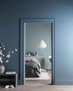 an instagram photo of a bedroom with blue walls