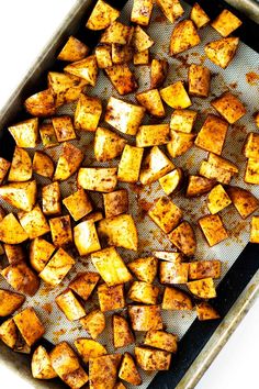 roasted potatoes on a baking sheet ready to be cooked