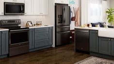 a kitchen with gray cabinets and white counter tops is pictured in this image from the front view