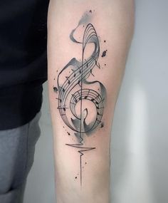 a tattoo with musical notes on the arm