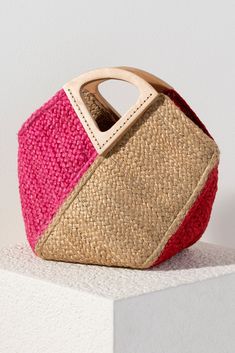 Stand out from the crowd this summer with Shiraleah's Jazz Mini Tote. This classic woven jute bag features a chic triangular top handle and both pink and red design for an extra pop of color. Pair with other items from Shiraleah to complete your look! Features a top handle and trendy multicolor design Shiraleah is a trend-driven lifestyle brand focused on the little gifts that make life special! Made from jute Measures L 16" x w 8" x h 12" Made in india Jute Bags Design, African Bag, Denim Jacket With Dress, Jute Bag, Fancy Rings, Embroidered Bag, Jute Bags, Red Design, Pink And Red