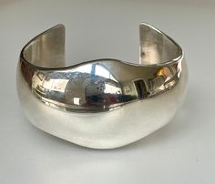 "This sleek yet substantial modernist cuff bracelet was made in the 1960s late modernist era, when this chunky, bold style was all the rage. It turns out that this has become a classic look, as this bracelet can be worn with jeans and business suit alike! It is solid Sterling silver, and is marked \"JRY\" by the designer. This bracelet came from a large modernist estate collection, however I cannot seem to identify the actual designer. I have seen the same maker's mark on other modernist pieces Vintage Silver Jewelry, Wide Cuff Bracelets, Modernist Jewelry, Bold Style, Stacked Jewelry, Bracelet Vintage, Wide Cuff, Business Suit, Maker's Mark