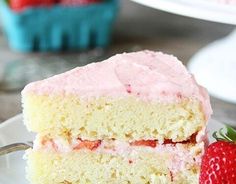 a slice of strawberry cake on a plate with a fork