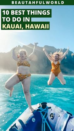 two women in bikinis jumping into the water from a boat