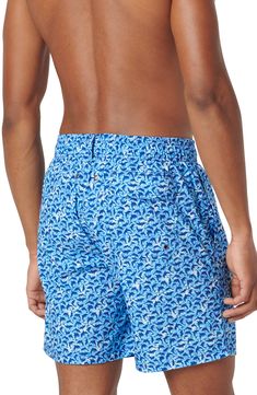 Bright and bold, these printed swim trunks made of lightweight, quick-drying fabric sport a roomy fit and plenty of pockets for essentials. Elastic/drawstring waist Side-seam pockets; back flap-patch pocket with drainage grommets Mesh liner UPF 50+ sun protection 100% polyester Machine wash, dry flat Imported Beachwear Bottoms With Side Pockets For Pool, Blue Cotton Swimwear With Drawstring, Relaxed Fit Swimwear With Pockets For Swimming, Cotton Swim Trunks With Drawstring, Cotton Swim Trunks With Drawstring For Swimming, Casual Swim Trunks With Functional Drawstring For Water Sports, Printed Relaxed Fit Swimwear For Poolside, Blue Sports Swimwear With Side Pockets, Casual Swim Trunks For Water Sports With Drawstring