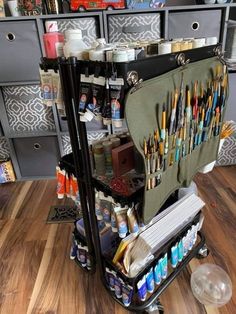 a cart filled with lots of art supplies