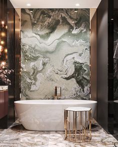 a bath tub sitting next to a wall with lights on it and a marble counter top