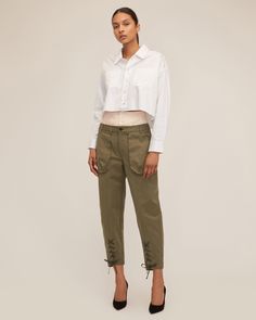 Honoring our brand's heritage, we updated the classic utilitarian cargo pant with feminine details. A high waist corset waistband is paired with vintage washed cargo details to give the Ada its modern feel. Pair the Ada with a classic white shirt or a tank for a ready to go everyday anywhere look. High corset waist Front fly zipper and Horn button closure Shell button closure on attached corset Front cargo pockets, back patch pockets with flap Belt loops Tapered Leg Front lace up detail at the h Cropped Cotton Bottoms With Belt Loops, Cropped Bottoms With Belt Loops For Workwear, Spring Military Cargo Parachute Pants, Chic Fall Cargo Parachute Pants, Chic Fall Cargo Style Parachute Pants, Cropped Pants With Belt Loops For Spring, Cropped Utility Bottoms For Fall, Fall Cropped Utility Bottoms, Chic Cargo Style Parachute Pants