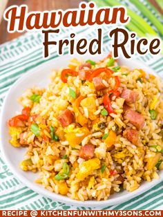 hawaiian fried rice with peppers and green onions on a white plate