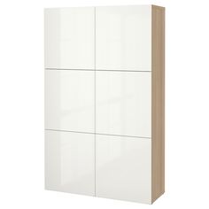 a white and wood cabinet with four doors