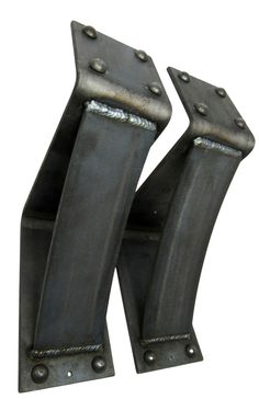 two black metal brackets on a white surface