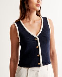 Women's The A&F Mia Button-Up Sweater Vest | Women's Tops | Abercrombie.com Casual Fitted Textured Knit Vest, Fitted Knit Tops With Buttons, Casual Knit Vest With Button Closure, Knit Button Sweater Vest For Fall, Knit Sweater Vest With Buttons For Fall, Knit Tops With Button Closure For Work, Fitted Knit Top With Button Closure, Sleeveless Knit Sweater Vest With Buttons, Fitted Knit Top With Buttons