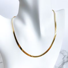 Slither into style with Alex Snake Chain! Guaranteed to give you a golden look, this luxurious snake chain will make sure you stand out from the crowd. Slip it on and show off your fierce fashion sense. Great for layering, or worn alone. Material: 18k gold plated on stainless steel Length: 16" + 2" extender Width: 4mm Trendy Gold Snake-shaped Chain Necklace, Trendy Gold Snake Shape Chain Necklace, Trendy Adjustable Snake Shape Chain Necklace, Trendy Snake Shape Chain Necklace With Adjustable Chain, Trendy Gold Snake Chain Necklace, Trendy Metal Snake Chain Necklace, Everyday Snake Chain Necklace, Trendy Gold Snake Chain Necklace With Adjustable Chain, Trendy Herringbone Necklace With Snake Chain