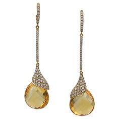 The fluid elegance of these Contemporary Citrine Diamond Pavé Drop Earrings, made in the 21st century, brings to mind the ornamental style that flourished between about 1890 and 1910 throughout Europe and the United States, characterized by its use of a long, sinuous, organic lines and expressive curvilinear forms. Art Nouveau, in architecture, interior design, illustration, and jewelry design, developed a graceful formal vocabulary to celebrate the natural world, both flora and fauna. These flo Formal Vocabulary, Curvilinear Forms, Fine Jewelry Pear-shaped Citrine, Citrine Jewelry 1stdibs, Fine Jewelry Citrine Multi-stone, Luxury Citrine Drop Earrings, Luxury Faceted Citrine Earrings, Golden Honey, Organic Lines