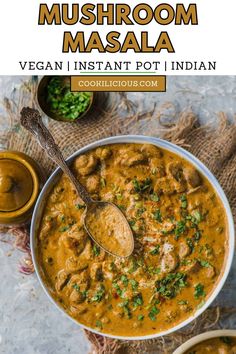 a bowl of mushroom masala with a spoon in it