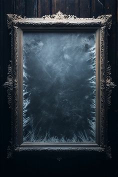 an old frame with frost on it in front of a wooden wall and black background