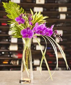 purple flowers in a vase on a table