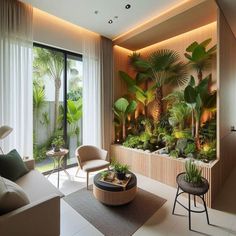 a living room filled with lots of plants