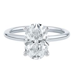 an oval cut diamond engagement ring on a white background