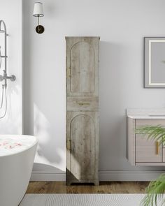 a white bathroom with a wooden cabinet next to a bathtub