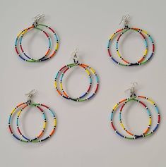 A set of 5 beaded hoop earrings , earrings for women, large hoop earrings, colorful earrings. Listing is for ALL 5 earrings. They make a perfect gift. The earrings measure 3 inches from top of the hook. **Buy multiple items and pay shipping for 1 item only.The rest ships free. Thank you for visiting. Multicolor Hoop Earrings With Large Beads As Gift, Colorful Handmade Hoop Earrings, Multicolor Hoop Earrings With Round Beads, Colorful Beads Hoop Earrings, Rainbow Hoop Beaded Earrings, Multicolor Beaded Hoop Earrings, Multicolor Hoop Earrings With Large Beads, Multicolor Tiny Beads Hoop Earrings, Colorful Beaded Circle Earrings