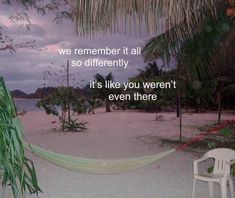 a hammock sitting on top of a sandy beach