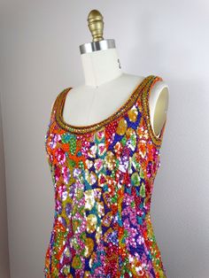 "This vintage beauty is by Oleg Cassini's Black Tie and it's fully embellished with bright sequins and beads in a funky, abstract design! It's in perfect condition! Measurements: Bust - 32/34\" Waist - 26/28\" Hips - 35/37\" Total Length - 35\" Tag Size - 4 All of my items come from a smoke-free and pet-free home. If you would like more info or have any questions, please don't hesitate to ask!" Vintage Sequin Dress, Sequin Dress Outfit, Iridescent Dress, Embellished Mini Dress, Multicolor Sequins, Dazzling Dress, Checkered Jacket, Embellished Dress, Vintage Beauty