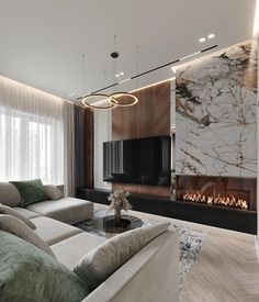 a modern living room with marble walls and fireplace