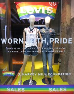 two mannequins in front of a store window with the words worth th pride