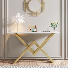 a white table with gold accents and a round mirror on the wall in front of it