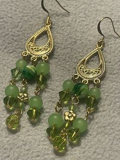 green glass beaded earrings with gold - plated earwires and dangling hooks