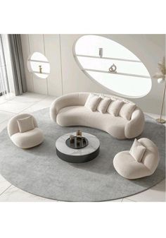 a living room filled with furniture and a round table on top of a gray rug