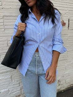 a classic button up staple with an open back concept for a super on trend look! this blue striped button up shirt bring coastal coastal corporate. pair with a fun bubble skirt, baggy jeans or trousers for a unique style! shop more trending tops here! size, details & care model size Dee is 5'5" 135lbs with a 34" chest, 27" waist, and 38" hip wearing a small details 60% polyester, 40% cotton care dry clean only do not bleach do not tumble dry Arizona Outfits, Trending Tops, Dressy Pants, Everyday Gifts, Bubble Skirt, Belt Purse, Small Details, Dressy Tops, Hair Accessories Jewelry