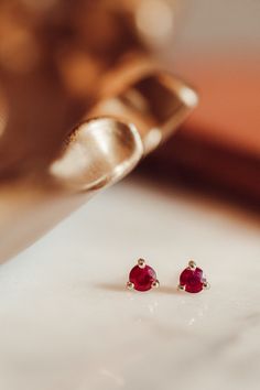 Gemstone 3 Prong Stud Earrings - Sarah O. Classic Ruby Earrings In Yellow Gold, Timeless 14k Gold Gemstone Earrings, Ruby Round Cut Fine Jewelry Earrings, Ruby Round Cut Earrings Fine Jewelry, Fine Jewelry Ruby Round Cut Earrings, Ruby Gemstone Earrings Round Cut, 14k Yellow Gold Solitaire Earrings, Dainty 14k Gold Gemstone Earrings, Classic Ruby Birthstone Earrings