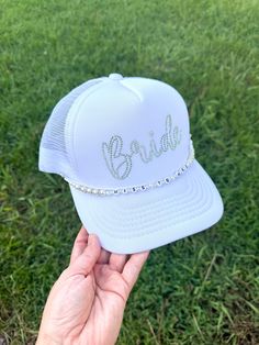 Make a sparkling statement at your bachelorette party or wedding events with this eye-catching rhinestone "Bride" trucker hat! Features: - Classic trucker hat style with mesh back for breathability - Front panel adorned with "Bride" in dazzling rhinestones - Adjustable snapback for a perfect fit - Color: White front panel with white mesh back -other colors available upon request - High-quality rhinestones securely attached for long-lasting shine Perfect for: - Bachelorette parties - Bridal showe Bachelorette Party Shots, Party Shots, Miss To Mrs, Custom Denim Jacket, Bridal Accessory, Custom Denim, Richmond Hill, Hat Style, Honeymoon Travel