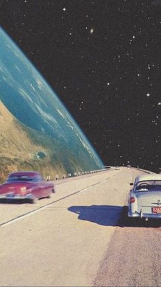 two cars are driving down the road in front of an earth - like landscape with stars