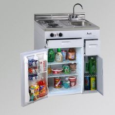 an open refrigerator with the door wide open and food in it's bottom compartment