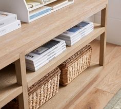 a wooden table with baskets and books on it