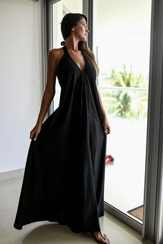 Experience elegance and allure with our Halter Dress Style Backless Maxi. This stunning dress features a captivating V-neckline in the front, complemented by a graceful halter style that accentuates your shoulders and back. The skirt flows beautifully, reaching down to create a long and full silhouette that exudes femininity. Crafted with meticulous attention to detail, this dress comes with a short underdress made of the same fabric, ensuring that you feel confident and comfortable without any unwanted transparencies. The halter straps are designed to be both stylish and supportive, featuring double fabric for added durability. We take pride in using high-quality, eco-friendly materials for our handmade creations. This exquisite dress is exclusively made with a blend of 50% cotton and 50% Elegant Halter Neck Top For Beach, Elegant Beach Halter Top, Chic V-neck Backless Dress For The Beach, Vacation V-neck Halter Top With Tie Back, Elegant Backless Halter Top For Beach, Elegant Halter Neck Backless Dress For Beach Season, Summer Backless V-neck Dress For Beach, Summer V-neck Backless Dress For Beach, Summer Wedding Halter Neck Dress