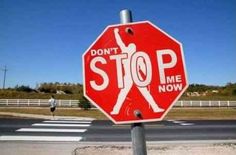 a red stop sign with the words don't stop me now written on it