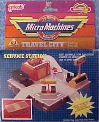 a toy set with luggage and cars on it's back side, in the packaging