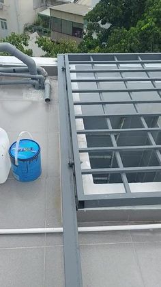 an image of a roof cleaning equipment on top of a building